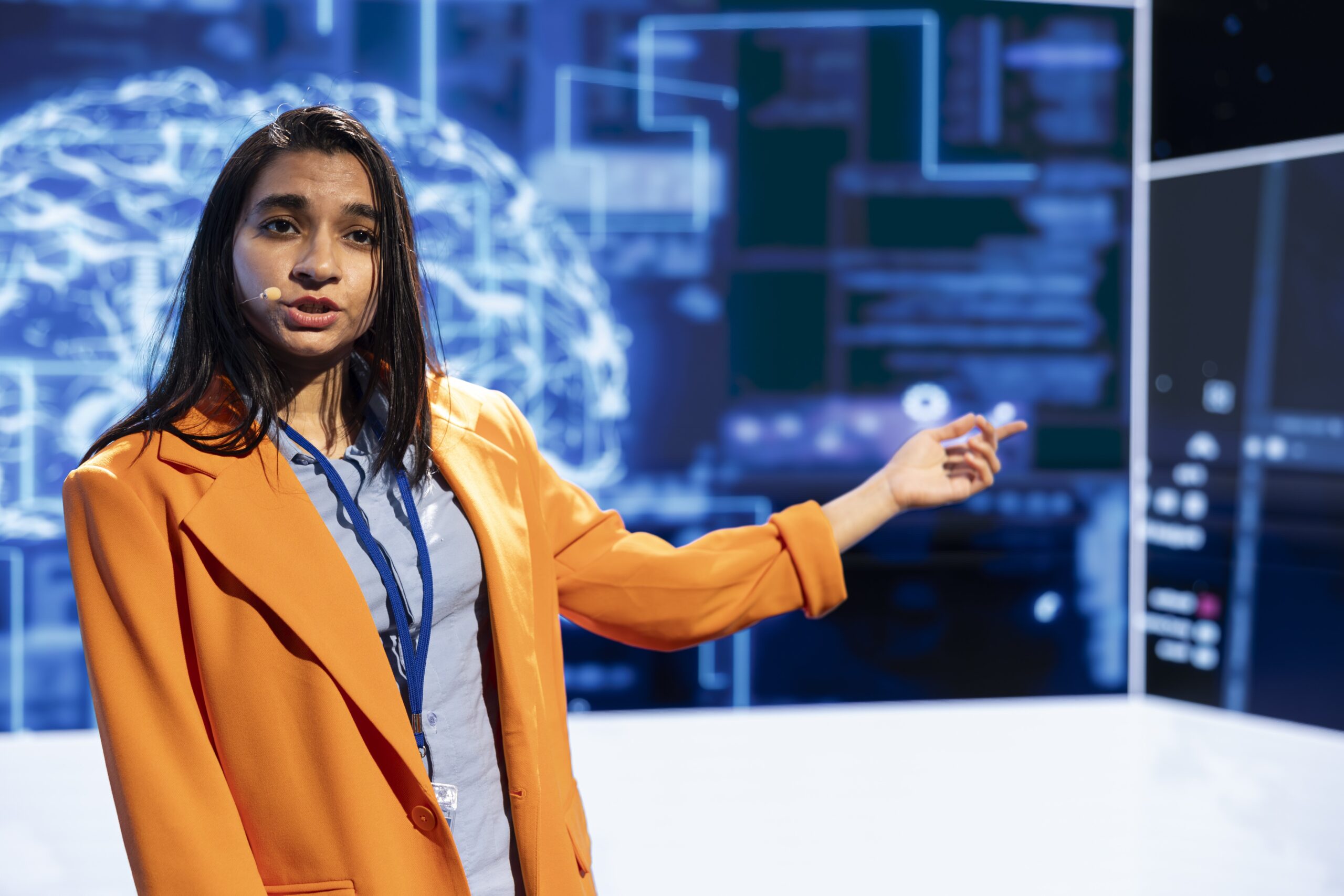 Speaker talking on stage in event bringing together leading AI specialists